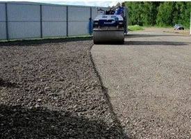 Construction of a road from asphalt crumb Construction of a road from asphalt crumb photo